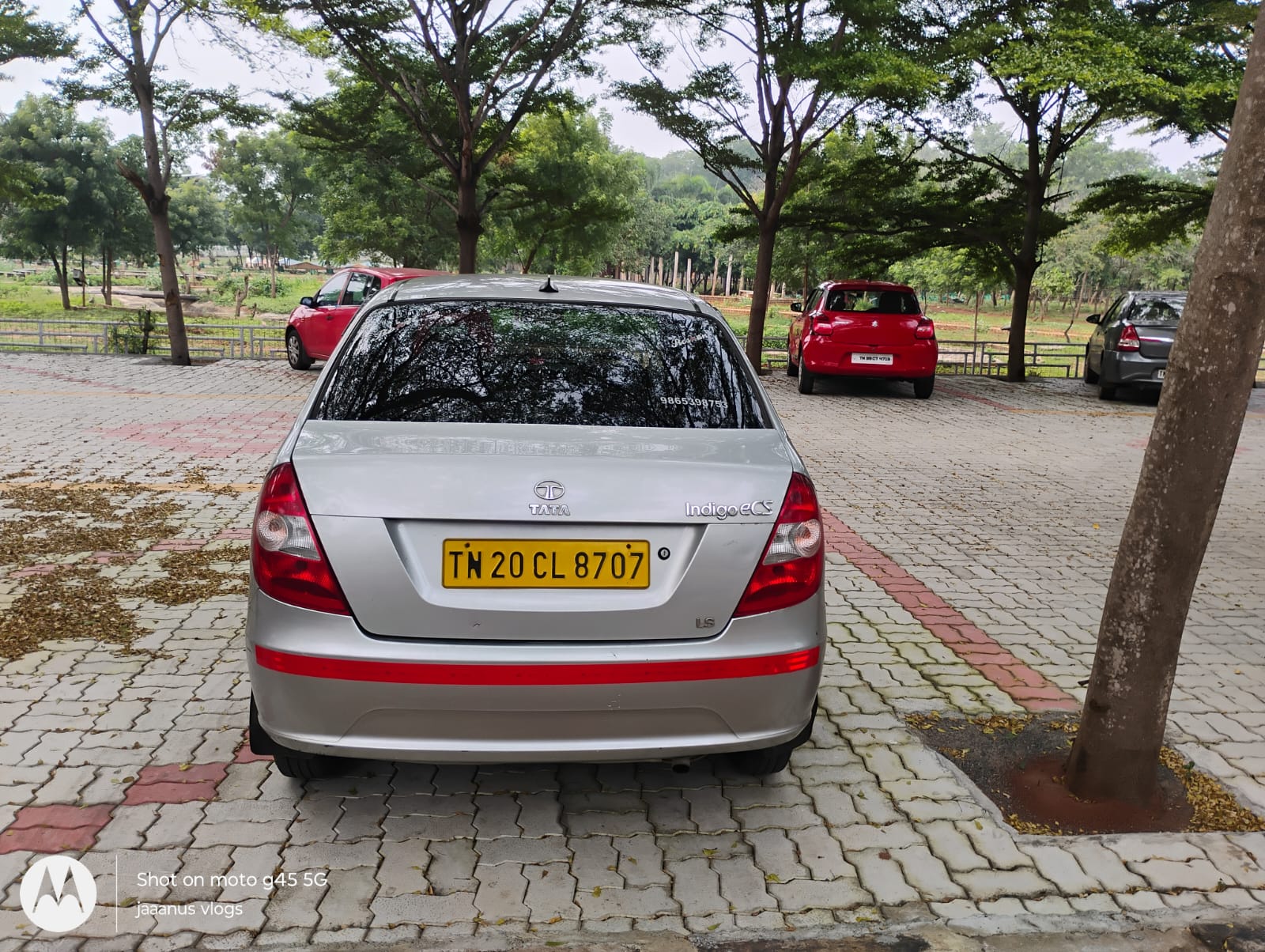 Alpha Cabs Trichy — sedan rear view with contact number